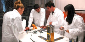Team of Engineers working on Satellite