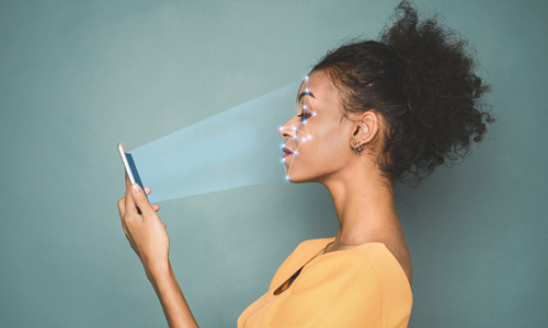 Woman getting face-sanned with phone