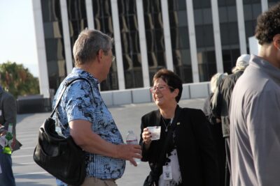 Terry Benzel lauging with a guest