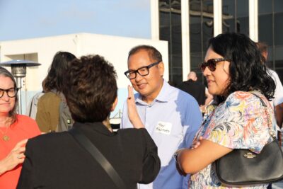 Terry Benzel speaking to guests