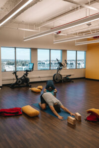 Yoga room with people practicing yoga