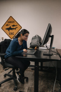 Researcher working on computer