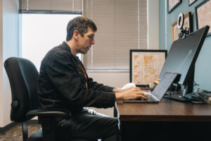 Researcher working on computer
