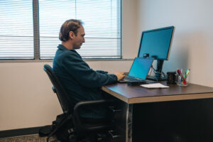 Researcher working on computer