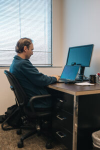 Researcher working on computer