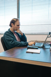 Researcher working on computer