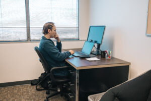 Researcher working on computer