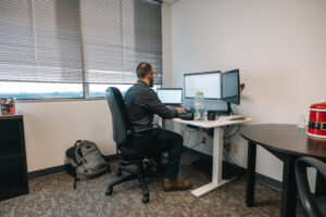 Researcher working on computer