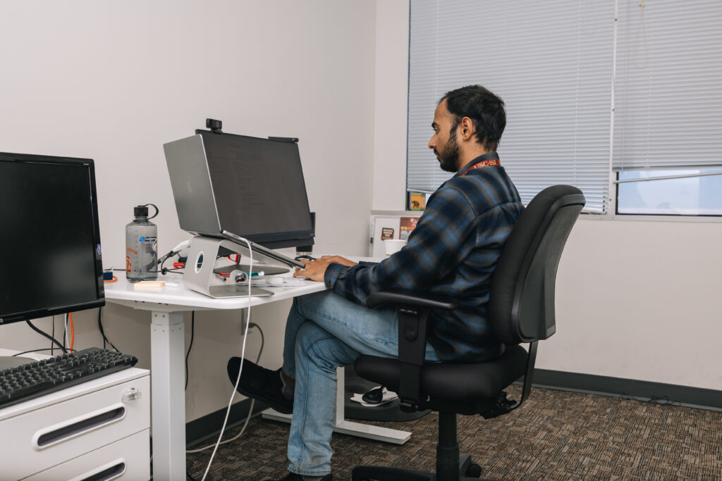 Researcher working on computer
