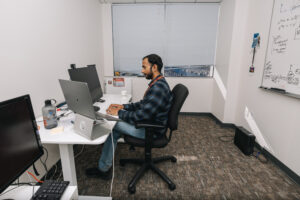 Researcher working on computer