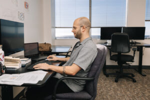 Researcher working on computer