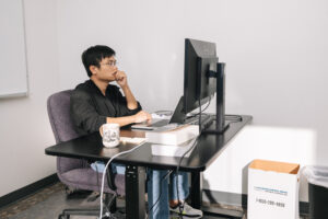 Researcher working on computer